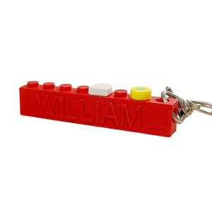 Colorful LEGO-style brick keyring with personalied name imbedded.