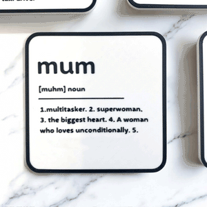 A black and white coaster with personalised name and description on the coaster.