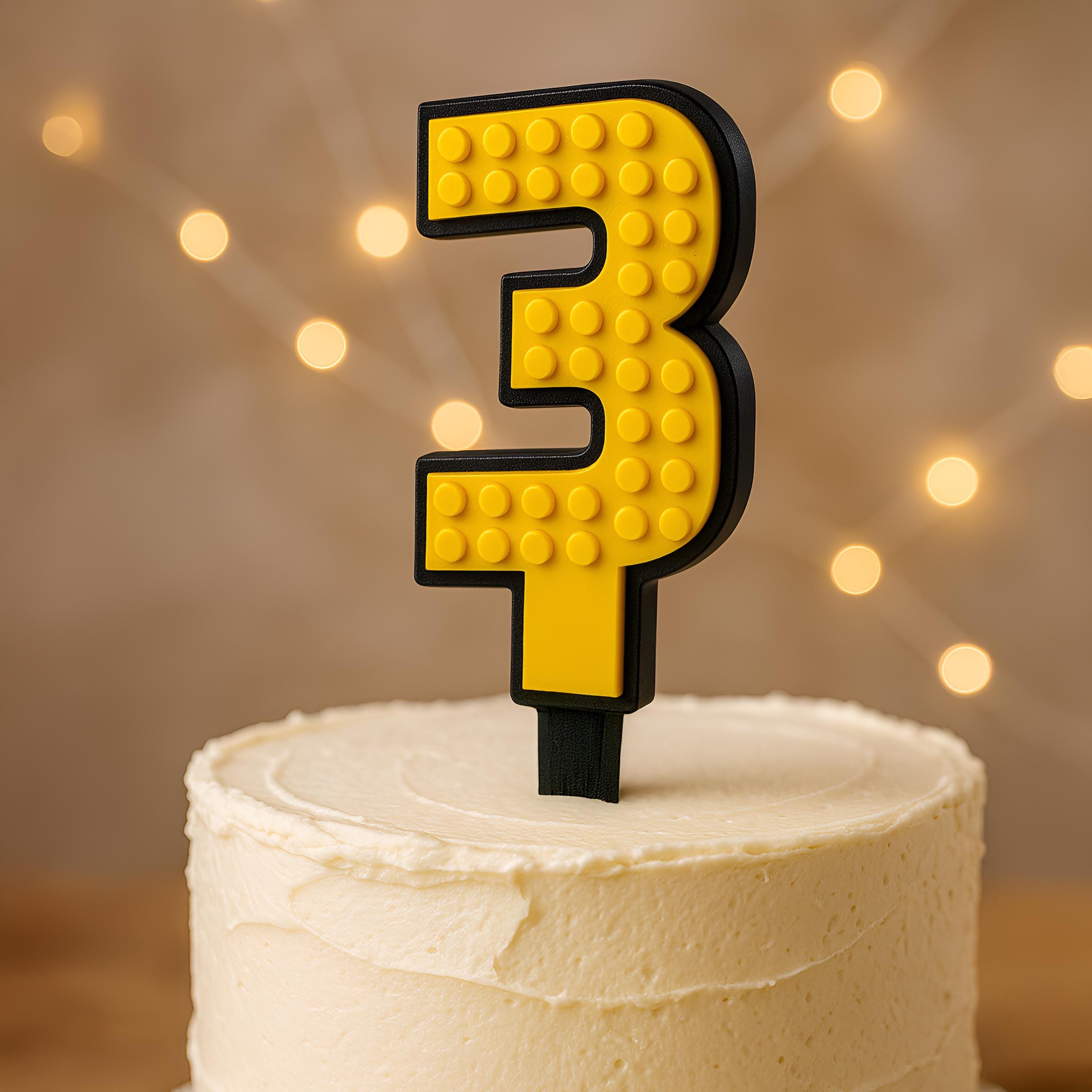 Yellow brick cake number 3 topper with black border on a cake