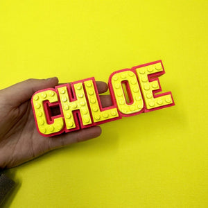 Colorful LEGO-style personalised name sign.