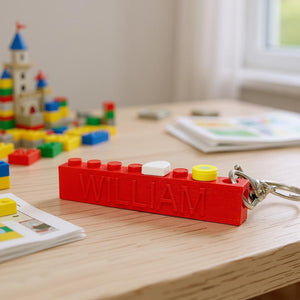 Colorful LEGO-style brick keyring with personalied name imbedded.