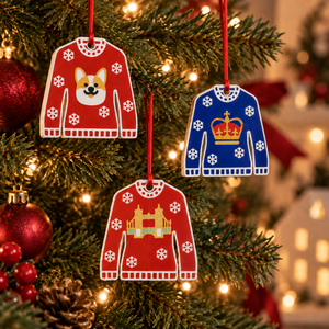 Corgi, Crown and Tower Bridge Christmas jumper decorations hanging on a Christmas tree