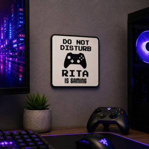 Personalised Do Not Disturb gaming sign with controller design and a name, on a wall above a gaming desk