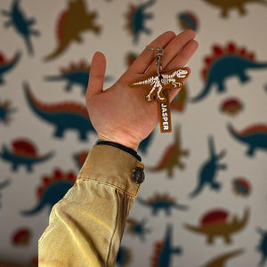 Dinosaur skeleton keychain with personalised name tag. 