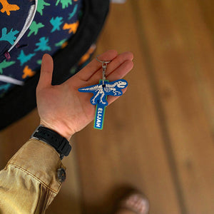 Dinosaur skeleton keychain with personalised name tag. 