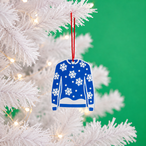 Snowfall Christmas jumper decoration hanging on a white tree