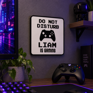Personalised gaming sign reading LIAM IS GAMING hung above a gaming desk