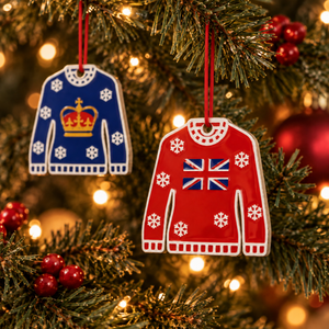 Crown and Union Jack Christmas jumper decorations hanging on a lit Christmas tree