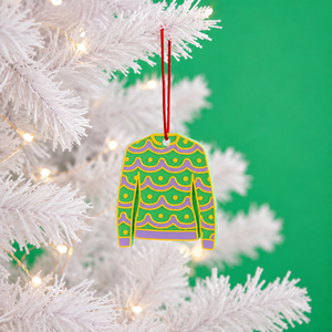 Tinsel Christmas jumper decoration hanging on a white tree